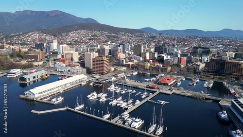 Hobart, Tasmania: Aerial drone footage of the Hobart downtown district and the harbor in Tasmania largest city in Australia. Shot with a rotation motion with Mt Wellington in the background