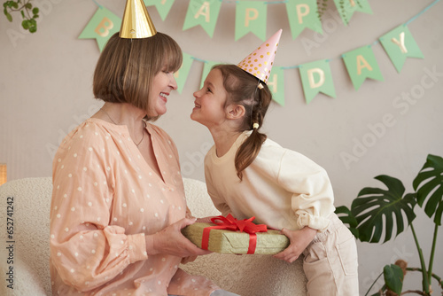 Family son his wife and granddaughter celebrate grandma birthday