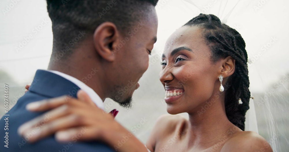 Outdoor, kiss and black couple with marriage, wedding and hug with happiness, romance and celebration. African man, happy woman and embrace outside, love and bride with groom, romantic and commitment Outdoor, kiss and black couple with marriage, wedding and hug with happiness, romance and celebration. African man, happy woman and embrace outside, love and bride with groom, romantic and commitment