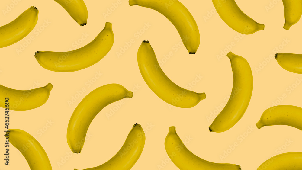 Composition with yellow bananas on a yellow background