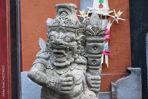 Traditional old ancient Balinese mask demon angel guarding sacred ritual temple