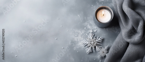  Christmas cozy composition with candles  snowflakes  decoration on grey concrete texture background. Top view. Flat lay. Still life. New year banner  mockup. Generative ai.