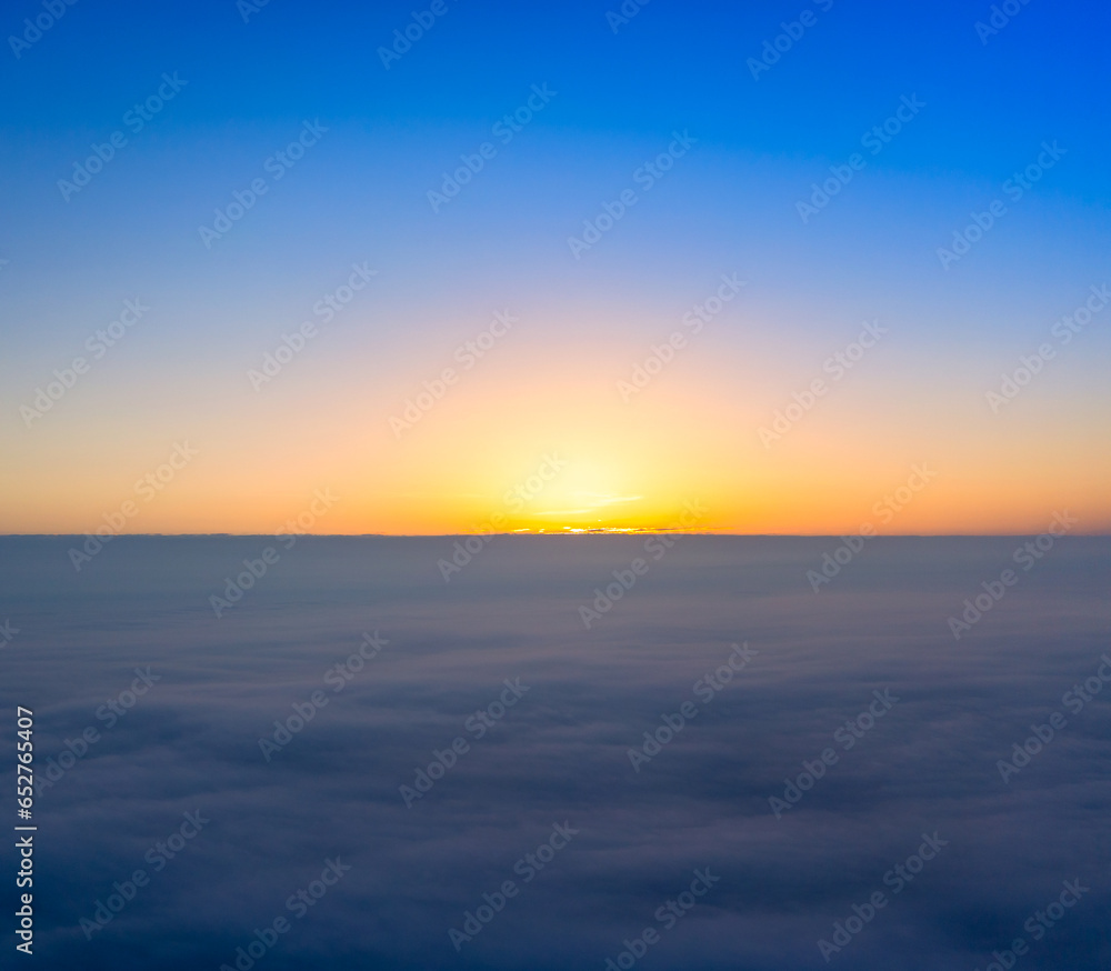 New Day Begins: Sunrise Over the Cloudy Horizon