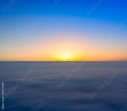 New Day Begins: Sunrise Over the Cloudy Horizon