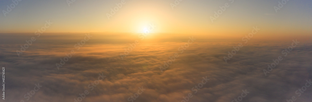 Above the World: Witnessing the Daybreak Above Clouds
