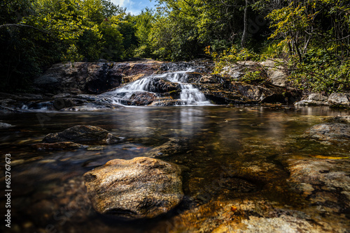 Fototapeta Naklejka Na Ścianę i Meble -  Small cascade on a river in a forest