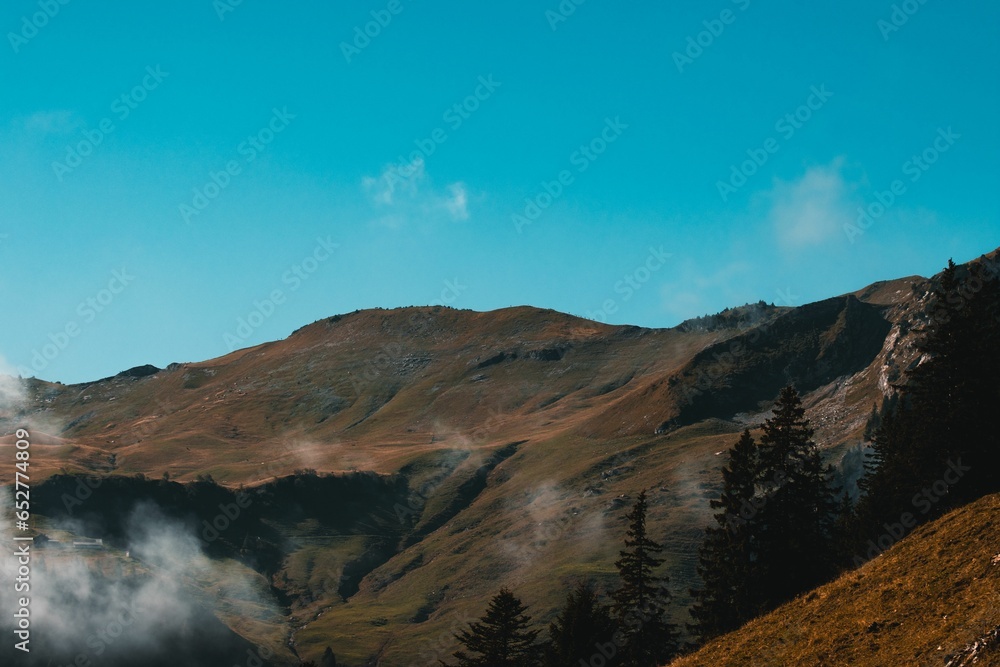 Scenic view of a mountainous landscape in sunny weather in blue sky background