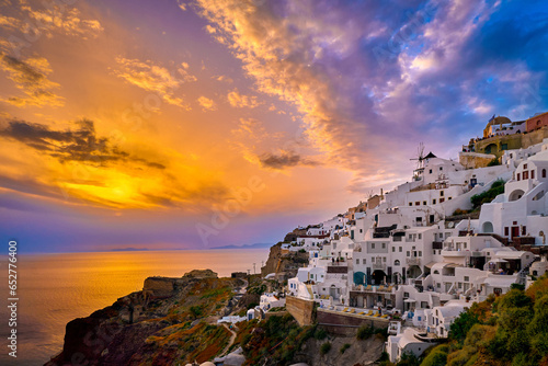 Obraz na płótnie Oia village, windmills, Santorini island, Greece at colorful sunset w salonie