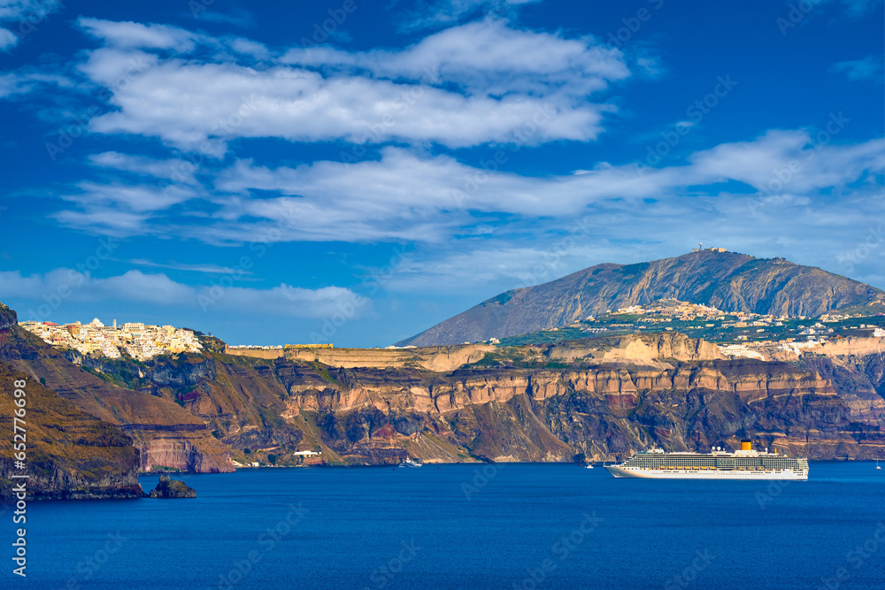 Panorama of Santorini, Greece, on sunny day, cruise ship, white towns