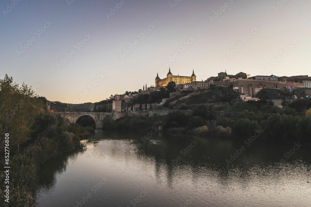 Beautiful sunset in the city of Toledo at the foot of the waters of the Tagus River.