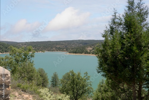 Photographic views of the lagoons of Una between green trees in the province of Cuenca