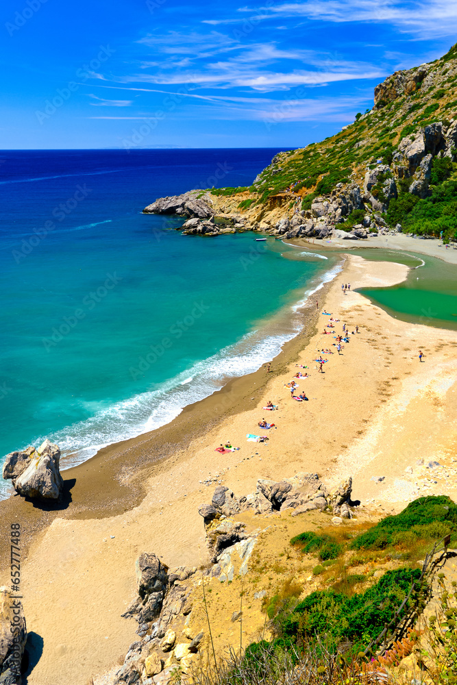 Panorama of sunny day at Preveli beach, Crete island, Greece.