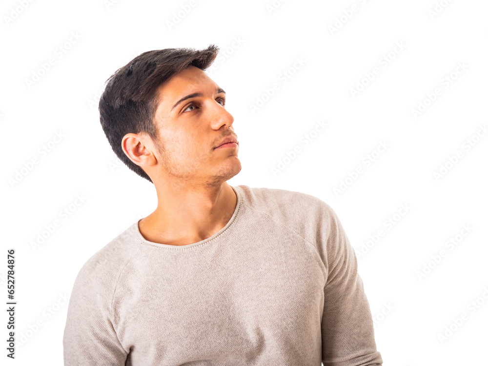 A man in a gray shirt is looking up to a side, isolated on white background in studio A man in a gray shirt is looking up to a side, isolated on white background in studio