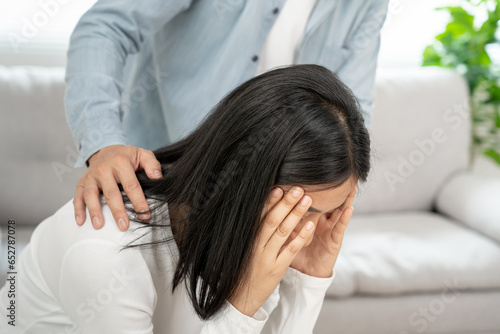 Couple support each while discussing family issues with psychiatrist. wife encourages and empathy husband suffers depression. psychological, divorce, trust, care, workplace and health issues..