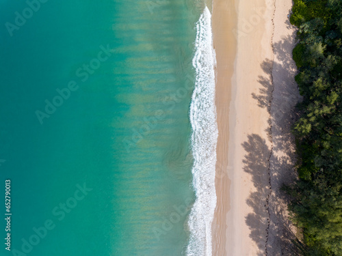Sea surface aerial view,Bird eye view photo of crashing waves on sandy shore,Beach sea water surface texture,sea sand background,Beautiful nature seascape,Amazing top view beach background