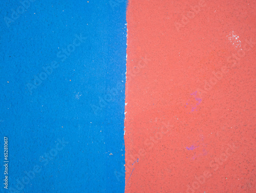 Quadro su tela Abstract blue and red textured background with vertical split, rough painted wal