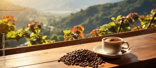 Front view of a wooden table with freshly brewed coffee a sack of beans plants coffee fields in the background and sun rays