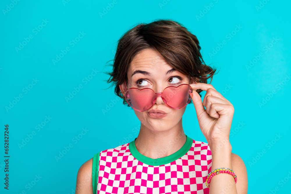 Photo of young lady pouted lips contemplation look novelty introduction new fashion design era isolated on aquamarine color background Photo of young lady pouted lips contemplation look novelty introduction new fashion design era isolated on aquamarine color background
