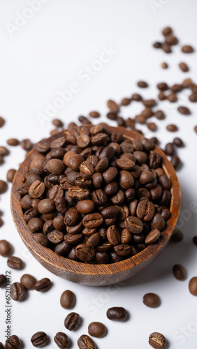 Roasted coffee beans in a wooden cup