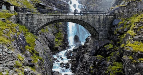 Landscape scene of Stone bridge near waterfall Stigfossen at  Trollstigen, Norway photo