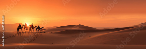 Saharan sand dunes, shades of red and orange, camel caravan in the distance, sun setting or rising