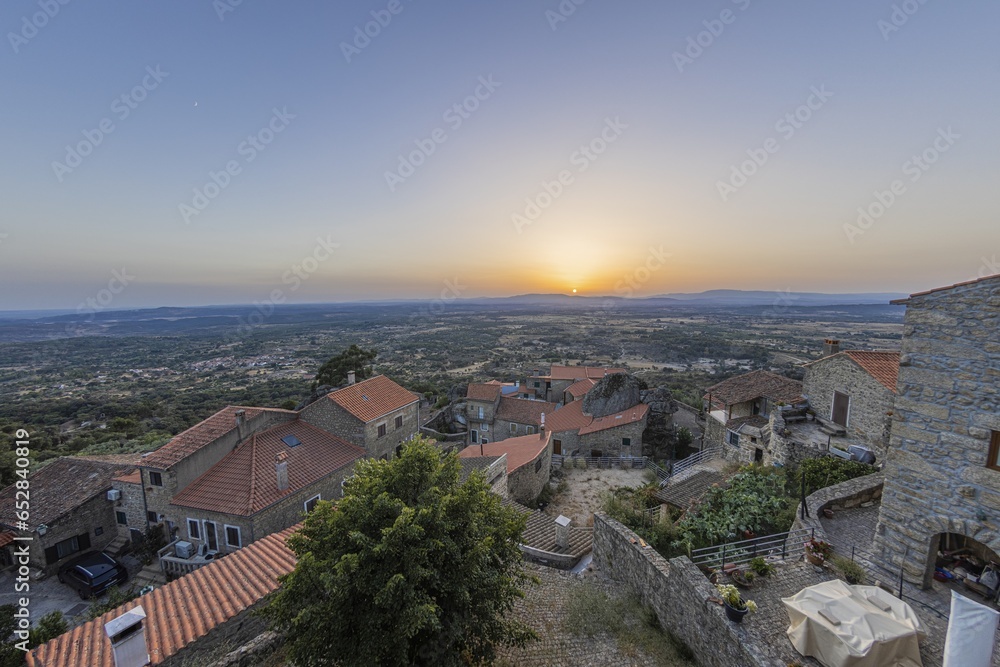 View over deserted historic town of Monsant in Portugal during sunrise