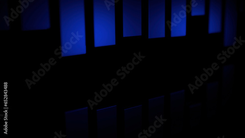 Black background with blue stripes. Design. Small vertical stripes that oscillate in different directions in abstraction.