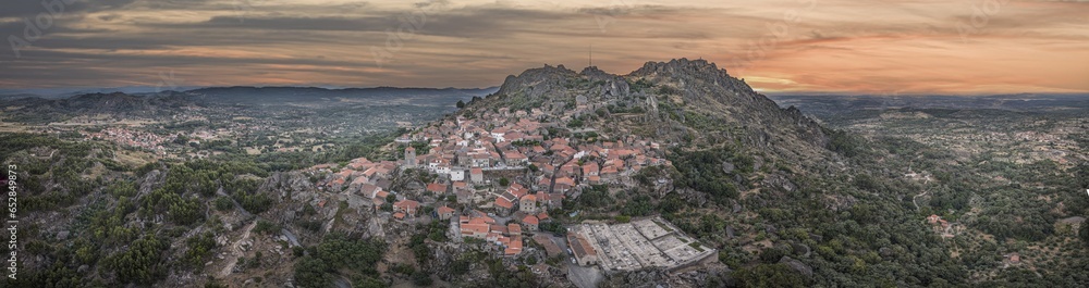 Drone panorama of historic city and fortification Monsanto in Portugal in the morning during sunrise