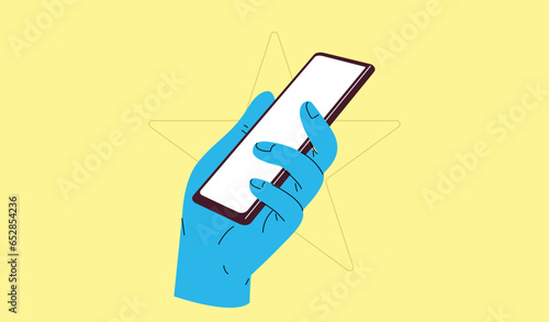 Hand holding smart phone on yellow background. Flat design