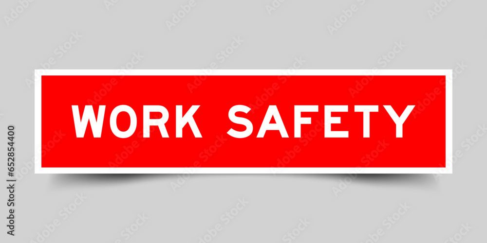 Sticker label with word work safety in red color on gray background Sticker label with word work safety in red color on gray background