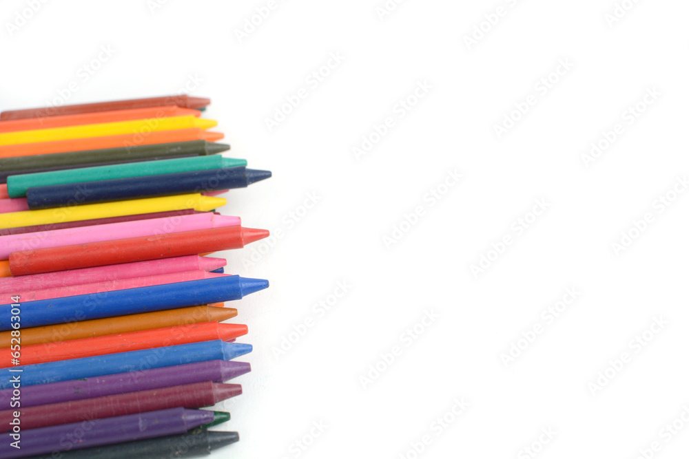 Crayons lined up isolated on white background. Crayons lined up isolated on white background.