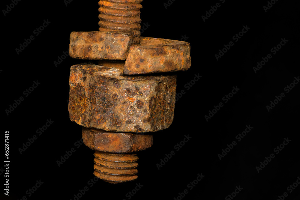 rusty nut. Rusty iron rod with screw threads. Rusted mechanical components. threaded bolt and nut isolated close up. dismantling concept, difficult to unscrew, non-removable. selective focus rusty nut. Rusty iron rod with screw threads. Rusted mechanical components. threaded bolt and nut isolated close up. dismantling concept, difficult to unscrew, non-removable. selective focus