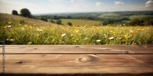 Empty Wood Table top on a Summer Nature Landscape Background with wildflowers