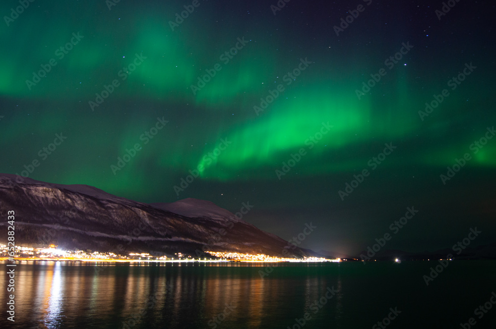 Green aurora borealis, northern light. Tromso, Norway. Winter in Norway