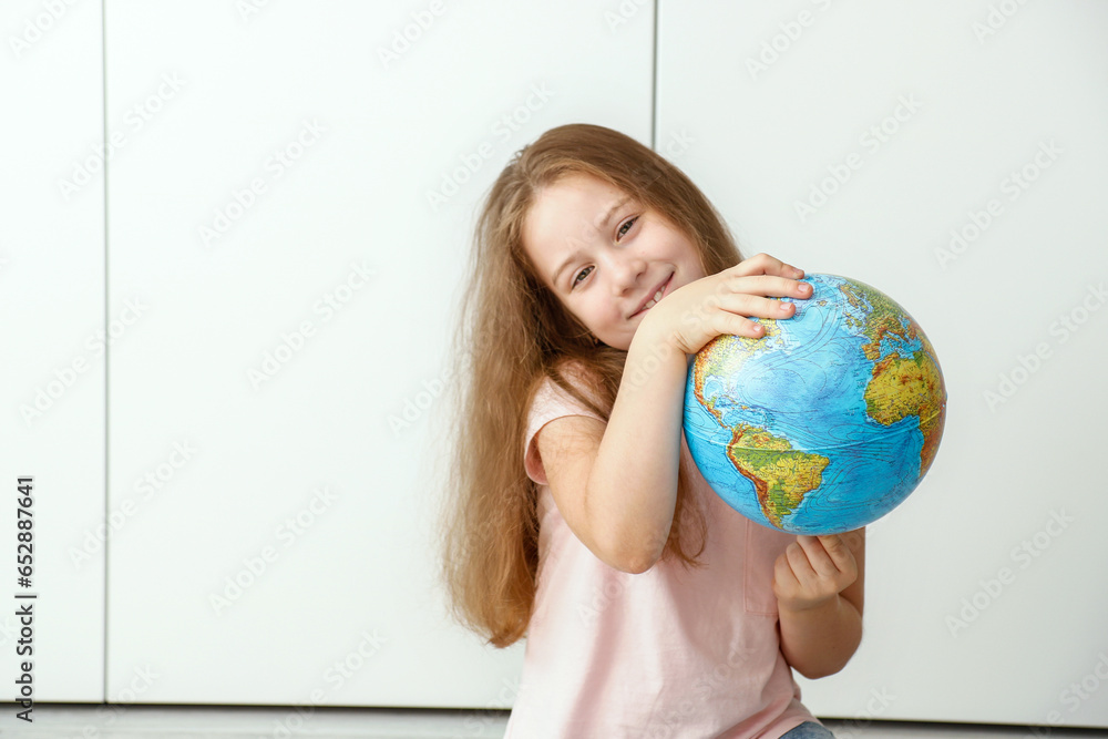 happy girl holding a globe in her hands happy girl holding a globe in her hands