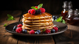 Inviting stack of pancakes adorned with syrup and berries on rustic table 