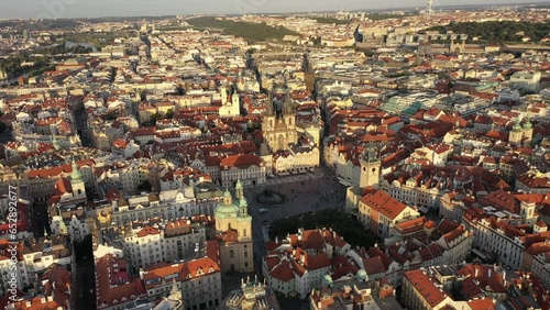 Sunny aerial drone view above Prague Old Town Square. Czech Republic. Summer. Sunset. Tourist town. City life.