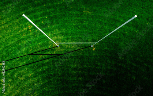 Aerial top down view of a freshly cut Rugby pitch and sole post