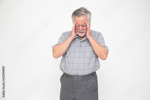 Asian senior man with a headache, dizziness or high blood pressure isolated on white background, Migraine in the elderly concept