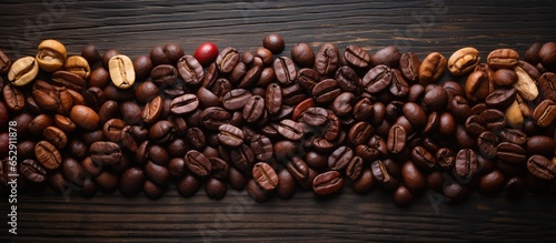 Different types of coffee beans photographed from above on a vintage background © AkuAku