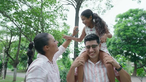 Mom Tickles Her Daughter, Mexican Family Having Fun