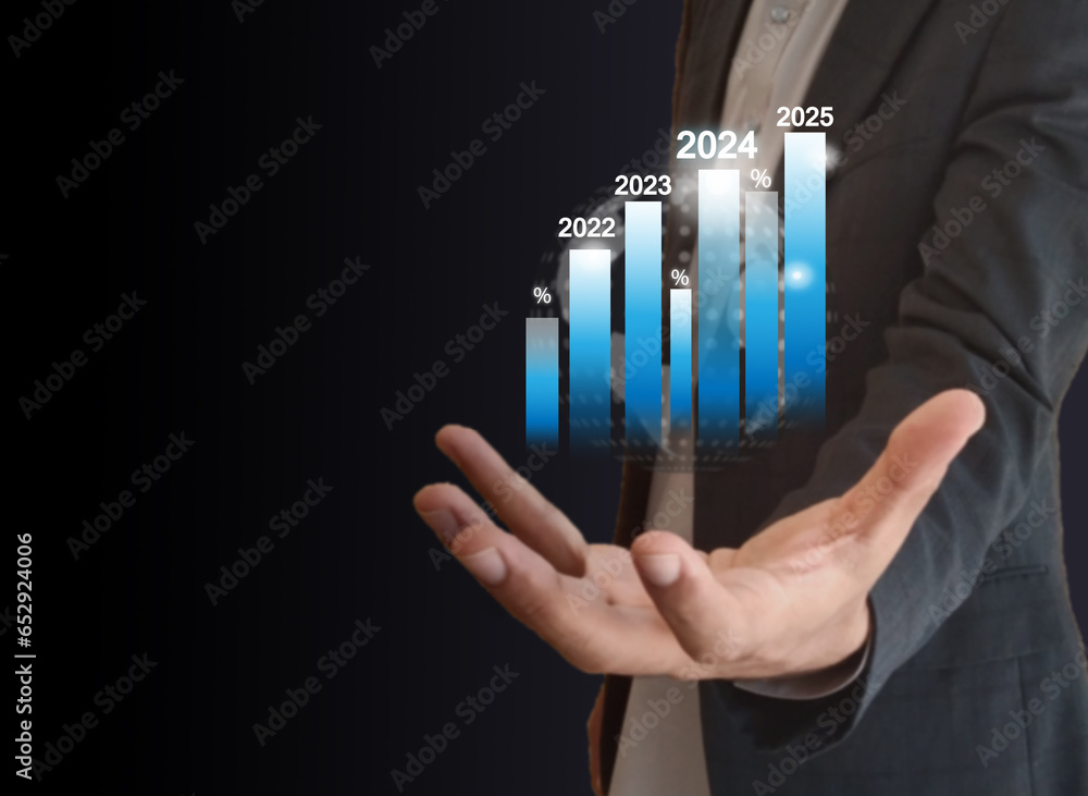 A Professional businessman having globe in hand 2024 chart showing 2024