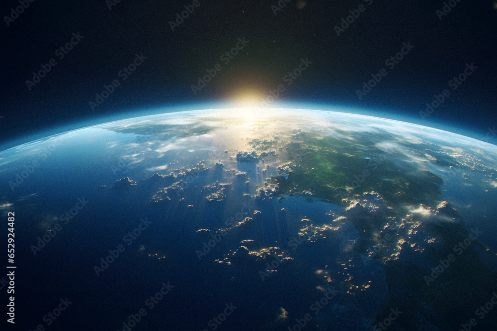 Fototapeta premium The Sun Rising Over Earth From Space