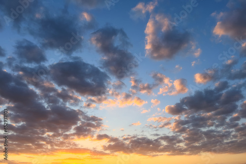 Golden hour sky with clouds. Ideal for sky replacement in modern photo editing software tools. © Gagula