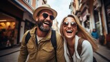 Two tourists are enjoying a walk on the city street on vacation. Happy friends laughing together on holiday people and holidays