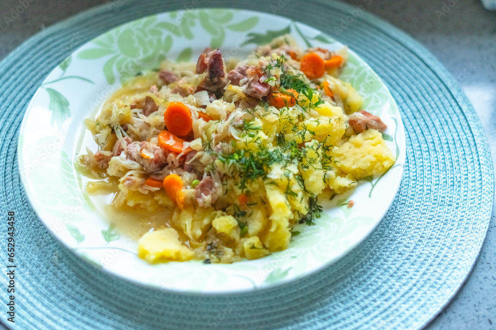 Traditional Polish food plate, cabage with meat and potatos Traditional Polish food plate, cabage with meat and potatos