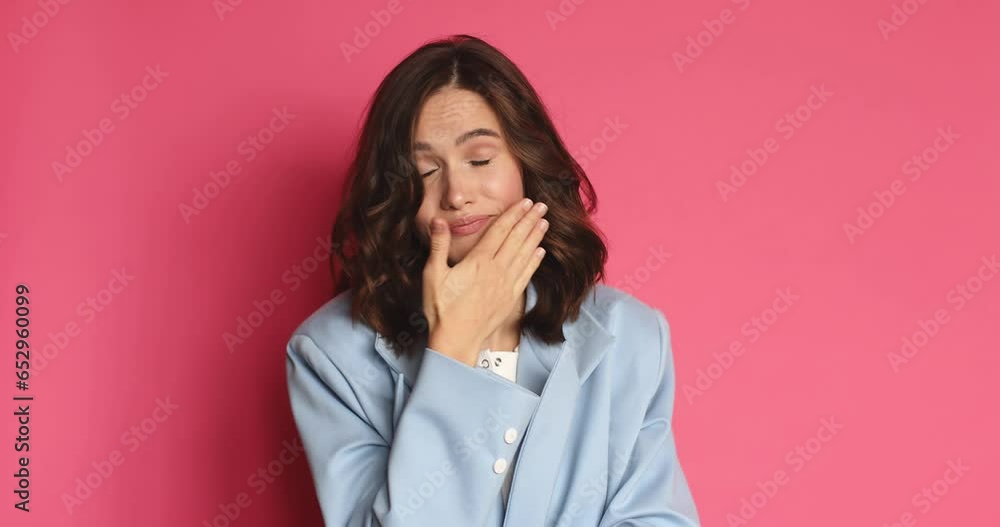 Boring cute brunette young woman in jacket posing isolated on pink background in studio. People lifestyle concept. Looks around, misses and waiting for something, gloomy and yawn. Boring cute brunette young woman in jacket posing isolated on pink background in studio. People lifestyle concept. Looks around, misses and waiting for something, gloomy and yawn.