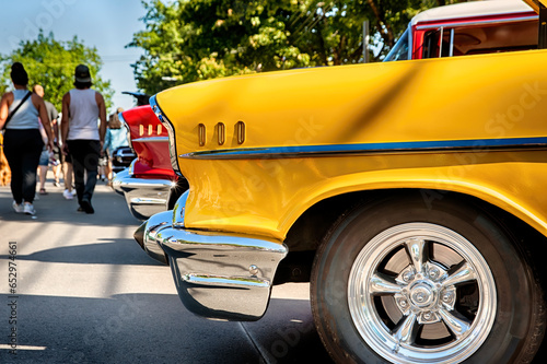 Fast vintage cars on display at cruise-in.