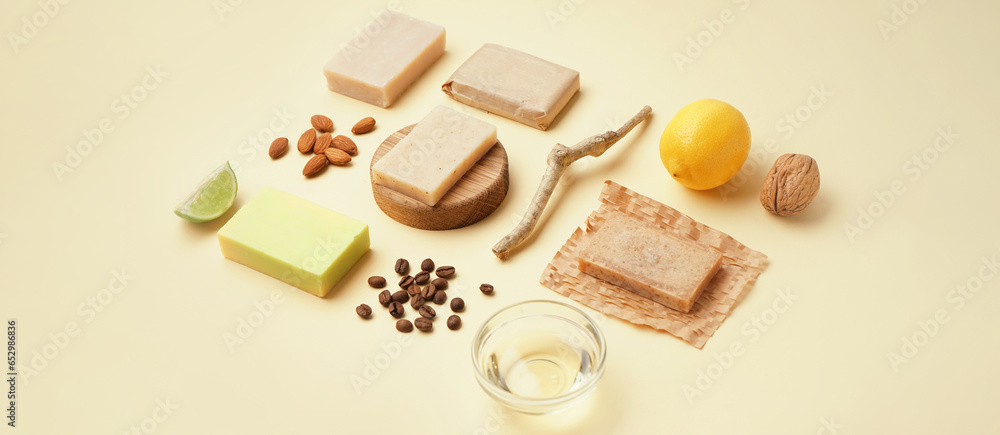 Composition with soap bars and natural ingredients on beige background Composition with soap bars and natural ingredients on beige background