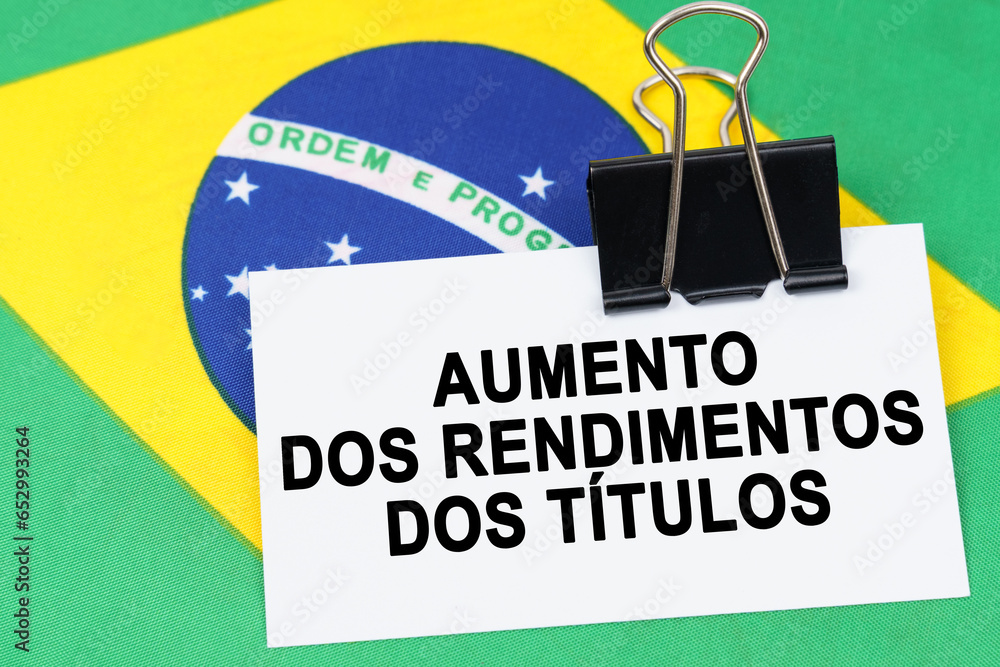 On the flag of Brazil lies a business card with the inscription - rising bond yields